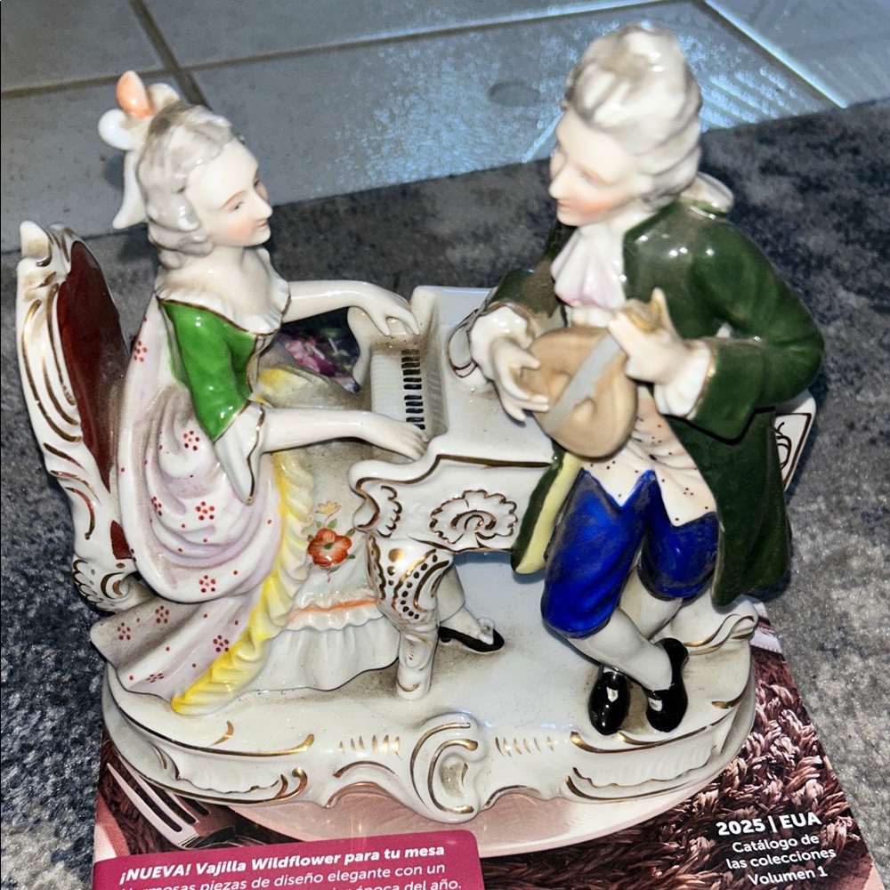 Elegant Porcelain Figurine with Musicians